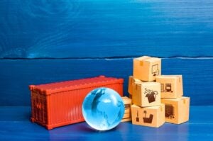 red-cargo-container-with-boxes-and-blue-globe-supply-chain